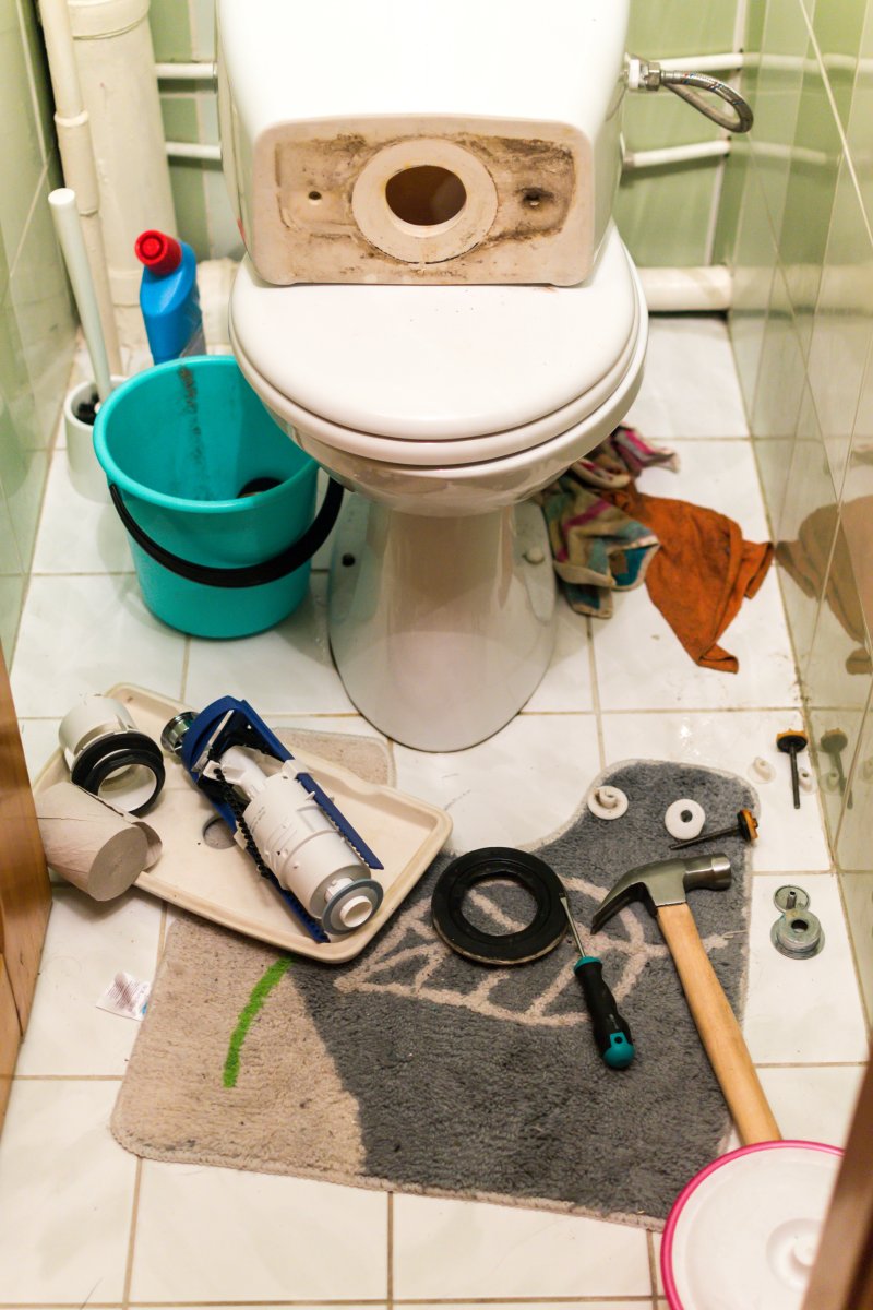New toilet being installed in a Hampton Hill bathroom